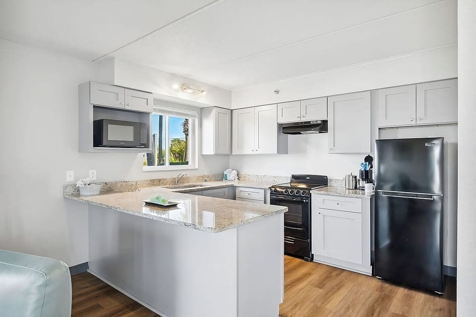 Cook vacation favorites in a fresh kitchen with sunny views.