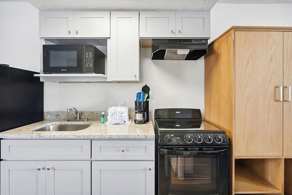 Whip up quick meals with full-size range and handy microwave.