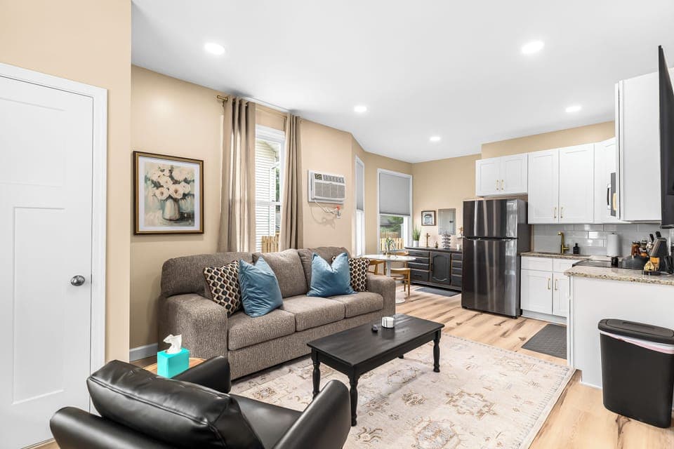 Relax in our inviting living room furnished with cozy seating and a smart TV for your entertainment.