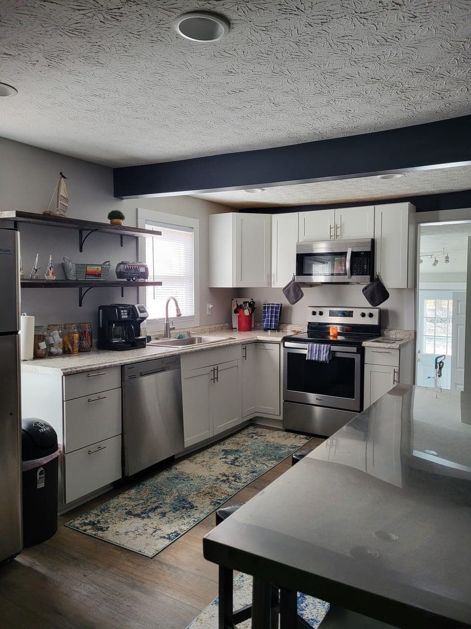 Full Kitchen with appliances, small appliances and TV