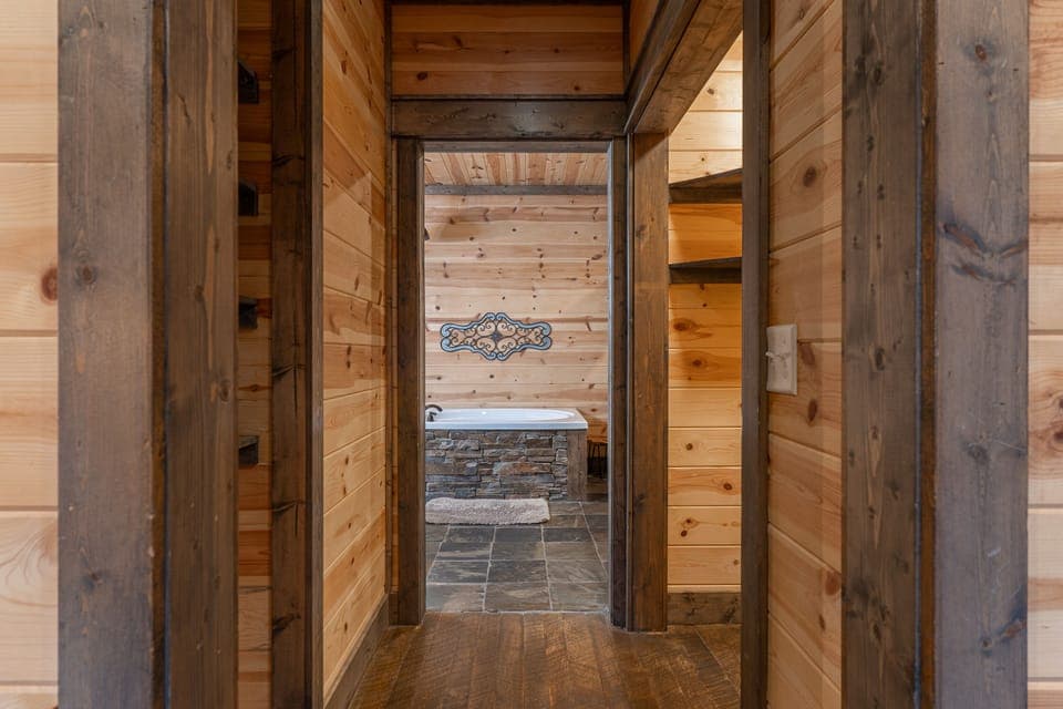 Attached ensuite is connected by a short hallway with a shelved closet on the left and a walk in closet on the right. Unpack and stay awhile!