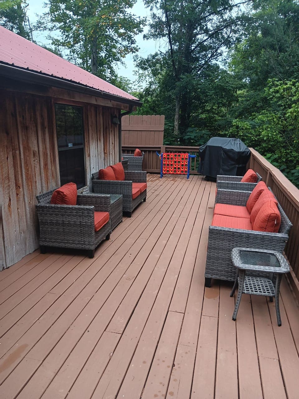 Large back deck with grill and hot tub