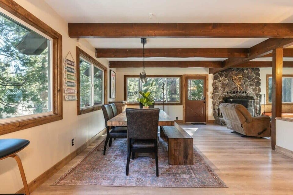 The dining area sits adjacent to the living room so you can stay connected to your group whether you are eating a snack or warming up by the fire.