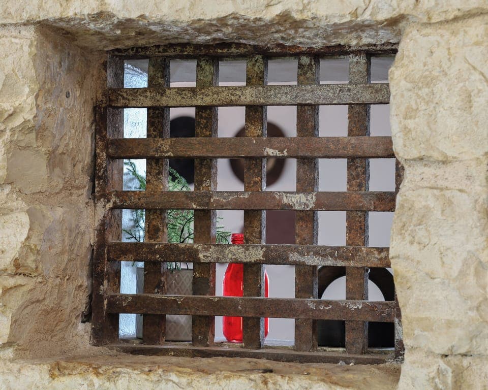 Original jail bar window looking through the "old exterior wall"