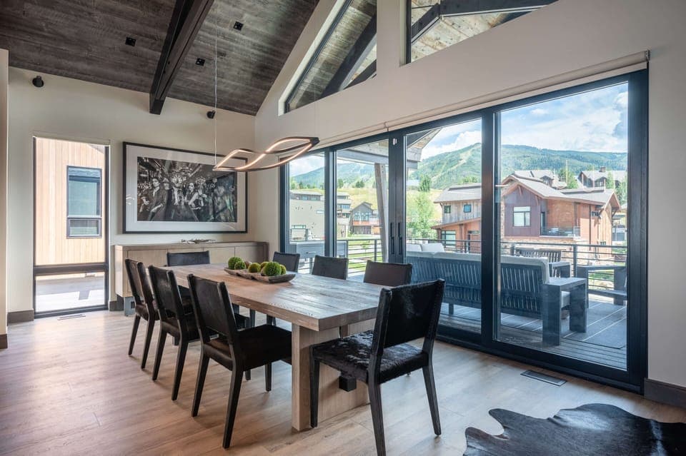 Sliding glass doors lead out onto the front deck