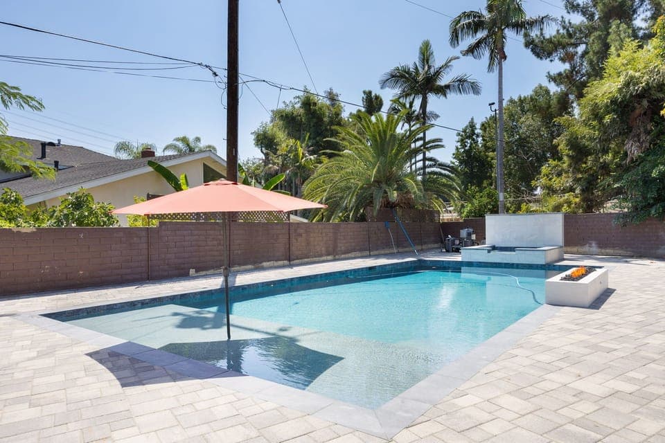 Private  Pool and Jaccuzi with Baja shelf, water fall and poolside fire pit, outdoor seating and bbq for grilling.