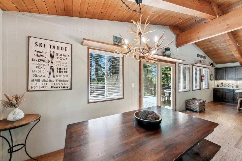 Cozy dining space with rustic charm and forest views—perfect for family meals, game nights, and lingering conversations.