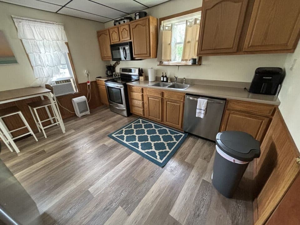 The spacious kitchen has been refitted with new, stainless steel appliances