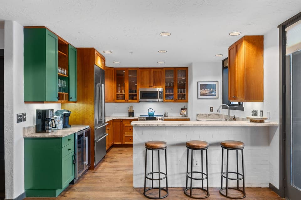  Kitchen has new high end appliances, wine fridge, and coffee bar