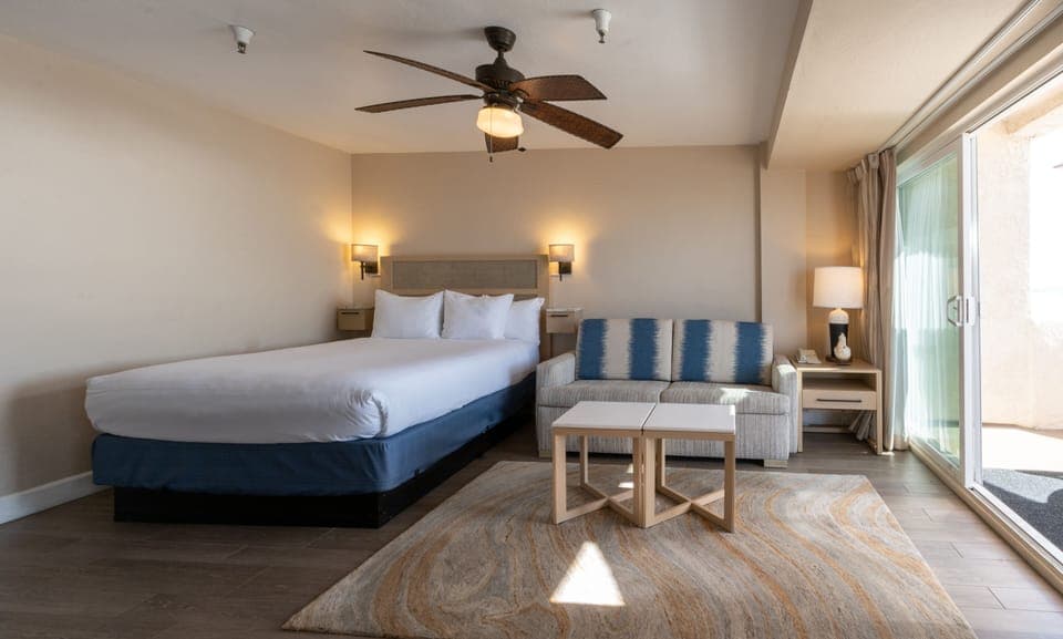 Drift off in crisp linens with ocean light nearby.