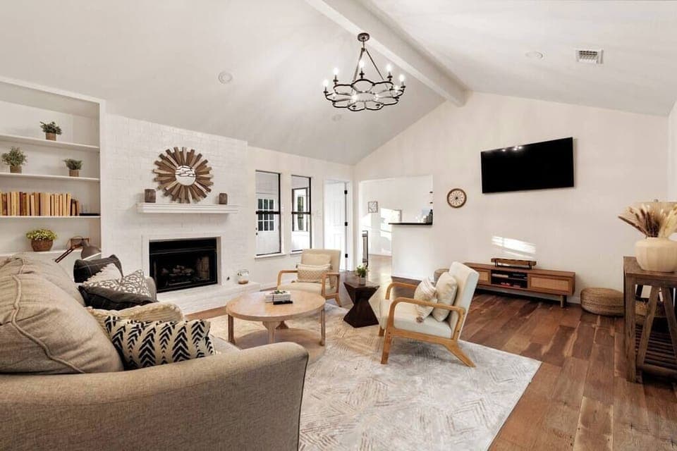 This cozy living room is the perfect place to hang out with family and friends. The comfortable couches and chairs provide a spot to kick back after a long day, while the coffee table keeps all of your favorite snacks within arm’s reach.