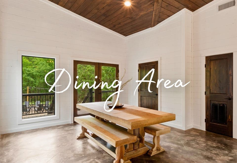 This dining area is all about rustic charm, with a sturdy wooden table and views of the woods, creating the perfect setting for a feast or a family game night.