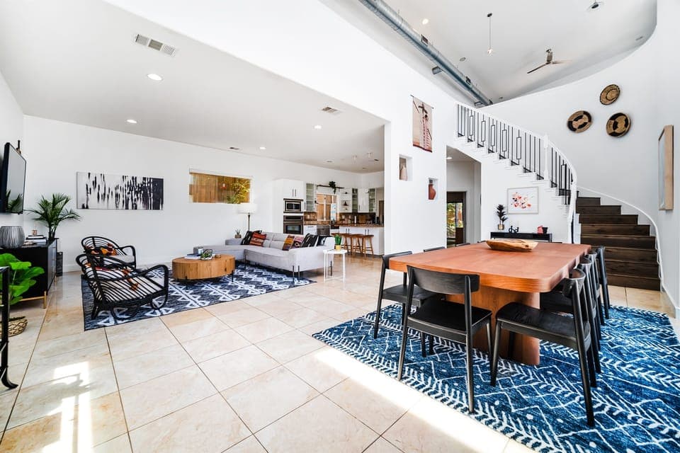 This captivating photo captures the seamless fusion of the dining area, living space, and sleek kitchen. An open-concept design that's both inviting and functional awaits your exploration.