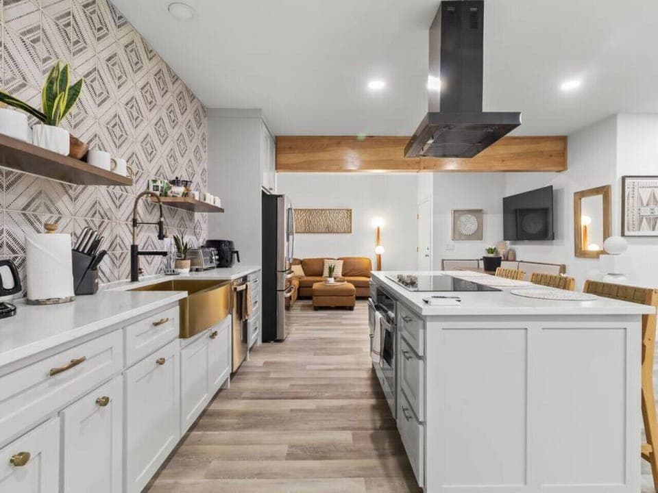 Main floor; Kitchen area - smartly organized with dedicated zones for cooking, prepping, and cleaning, ensuring a clutter-free and functional culinary workspace.