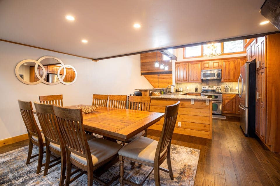 A view of the dining table and kitchen!
