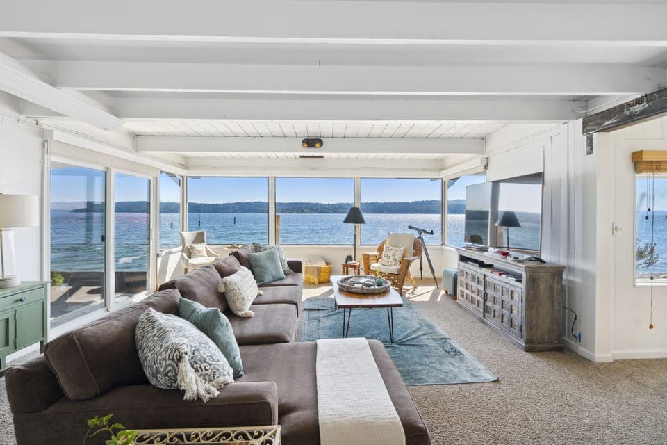 Step into a breathtaking living room that seamlessly blends the comforts of home with the awe-inspiring beauty of nature.