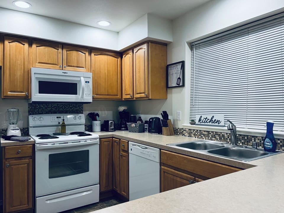 Kitchen fully stocked with utensils, pots, pans, toaster, blender, coffee, etc.