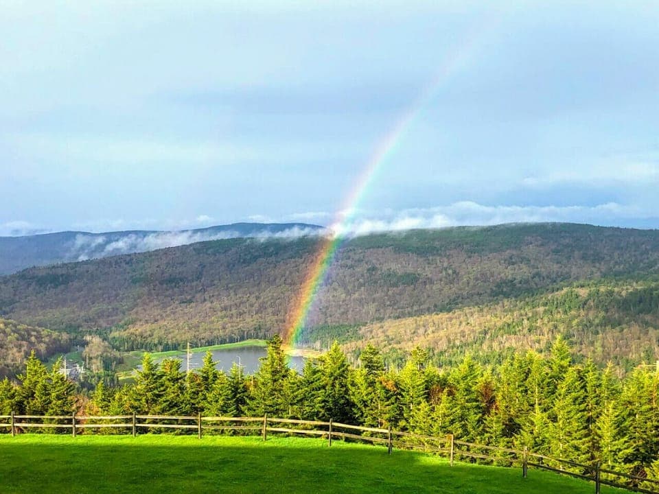 Large grassy area located in the rear of Mountain Lodge