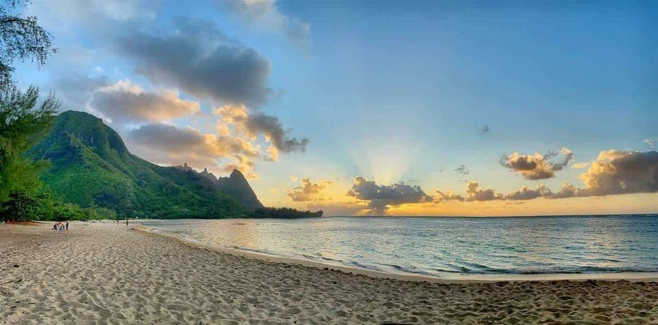 Marvel captivating sunsets at Tunnels beach, a breathtaking spectacle of vibrant hues reflecting upon the pristine waters