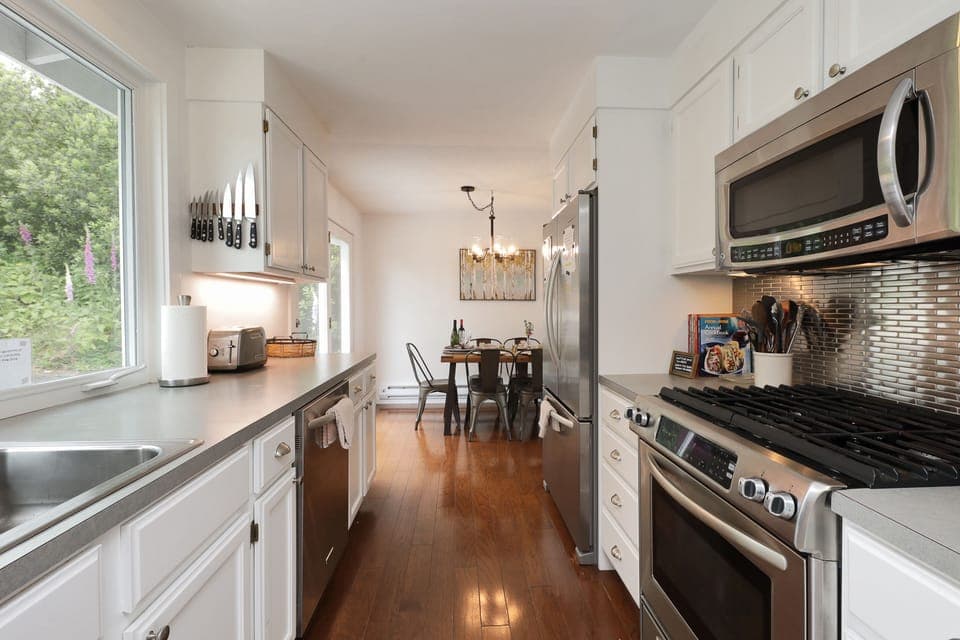 Fully equipped kitchen with sleek and modern appliances.