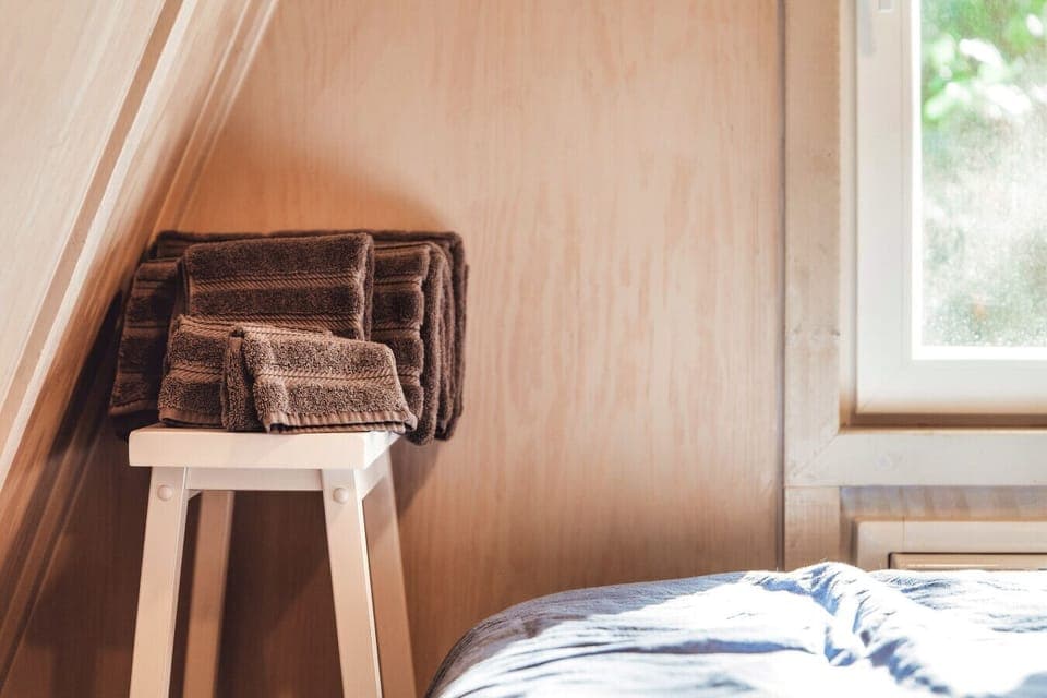 Fresh, fluffy towels are left beside the bed for each guest at the Blue Brambler.