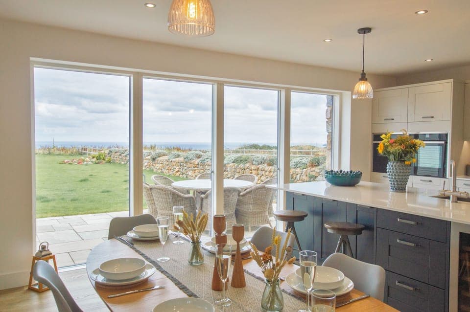 Polberro Cottage, Ground Floor: Large sliding doors connect the open-plan area to the beautiful garden