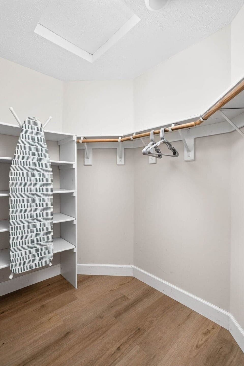 an ironing area and a spacious closet for your convenience.