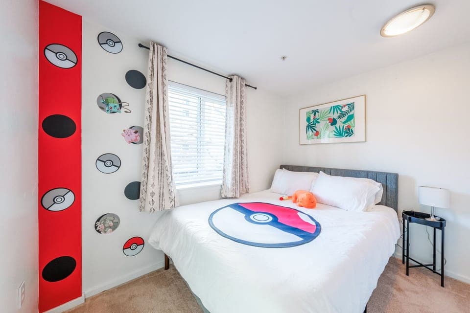 Bedroom 2 features memory foam queen bed and captivating views of the monorail.