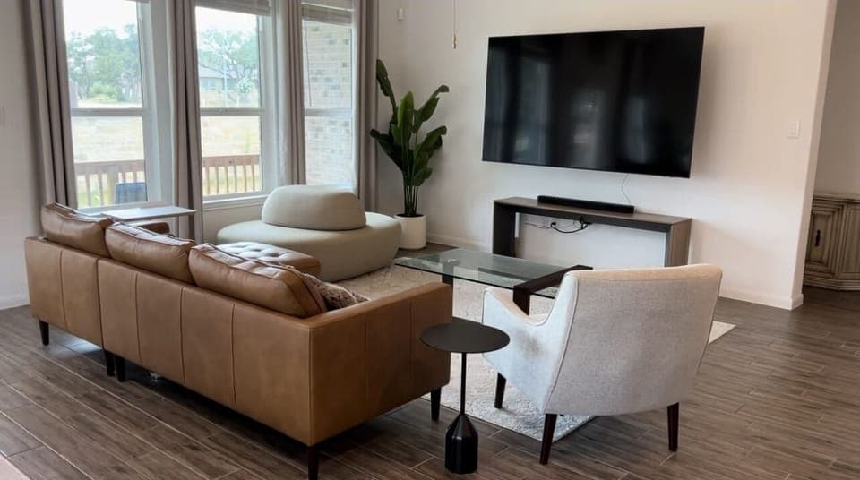 Main living room witb 85” TV and Surround Sound