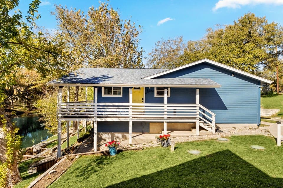 Welcome to Water Haus—a charming riverfront retreat nestled directly on the peaceful Guadalupe River between the 3rd and 4th Crossing along historic River Road.