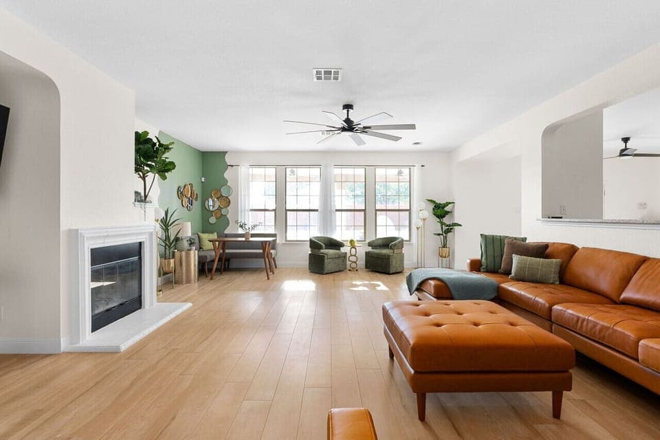 Cozy evenings in the spacious living area: Gather `round the table firepit, relax, and catch your favorite shows on TV.