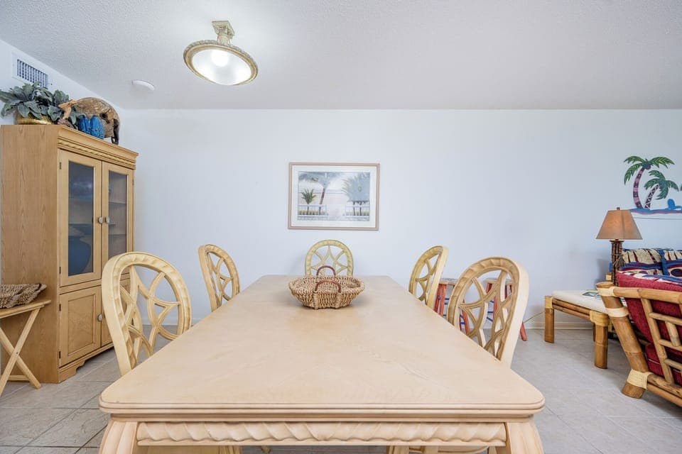 Gather around the spacious dining table, perfect for meals and enjoying the coastal decor that enhances your stay