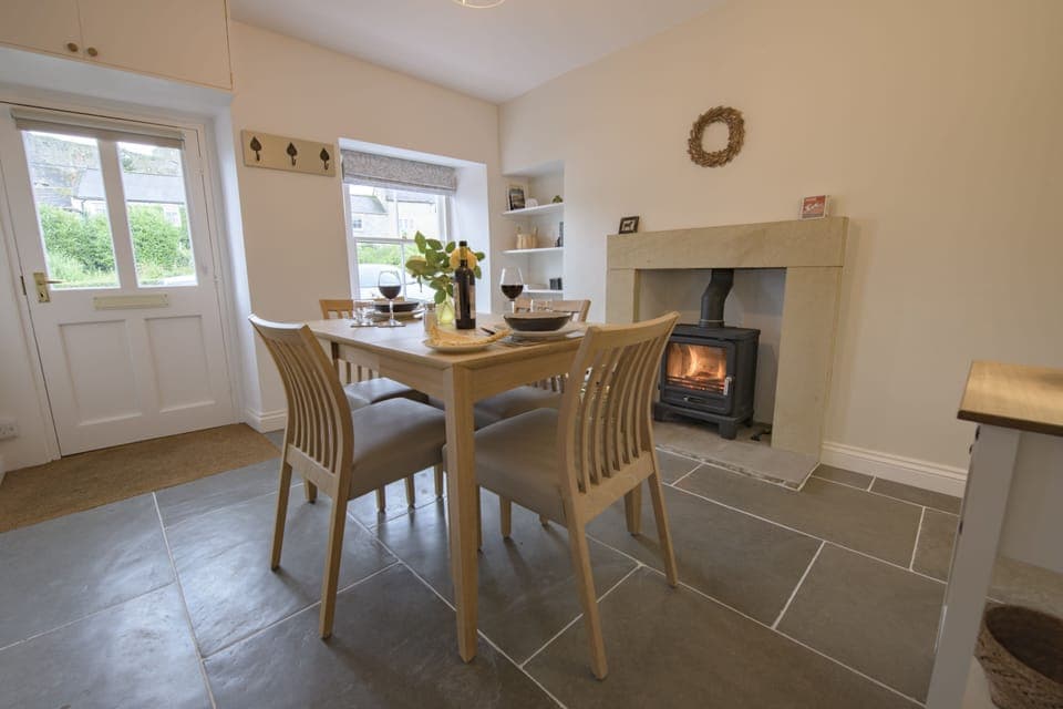 Penny Pot Cottage, Middleham: Dining room with cosy wood burning stove