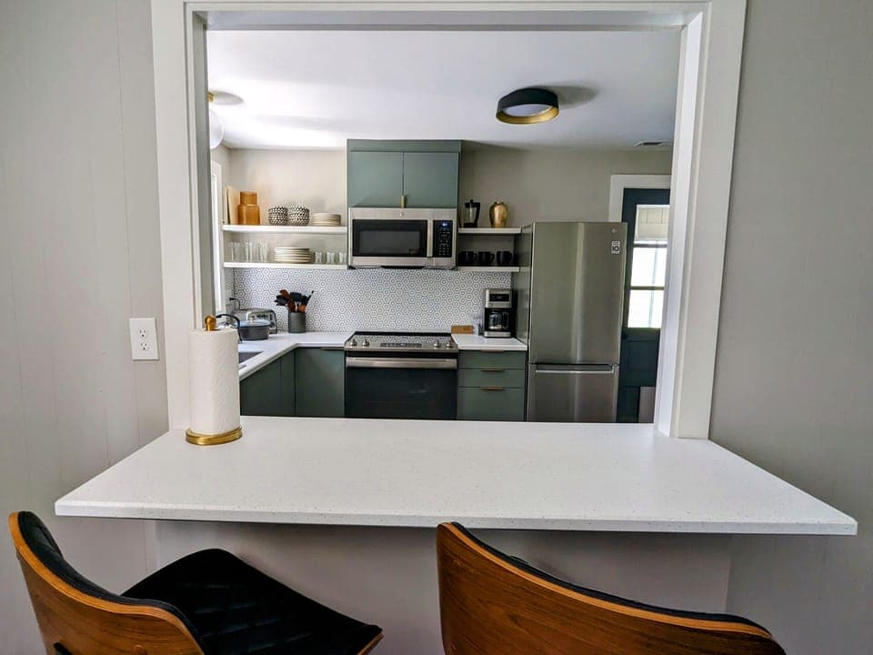 Bar Seating that looks into the Fully Equipped Chef's Kitchen