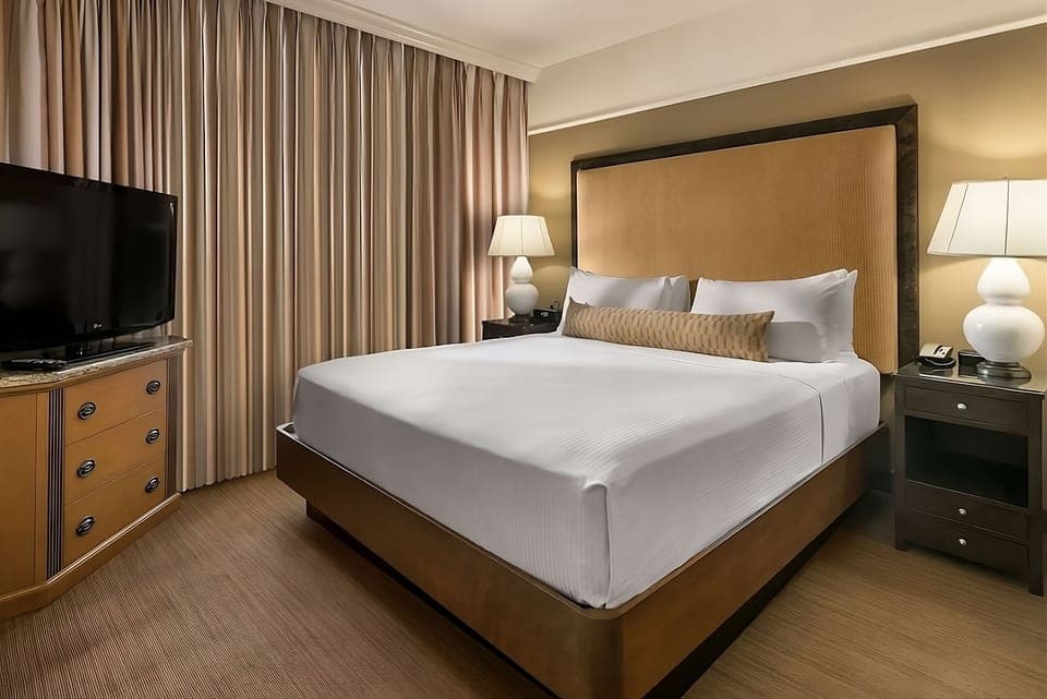 Relax into crisp linens and a calm, quiet room.
