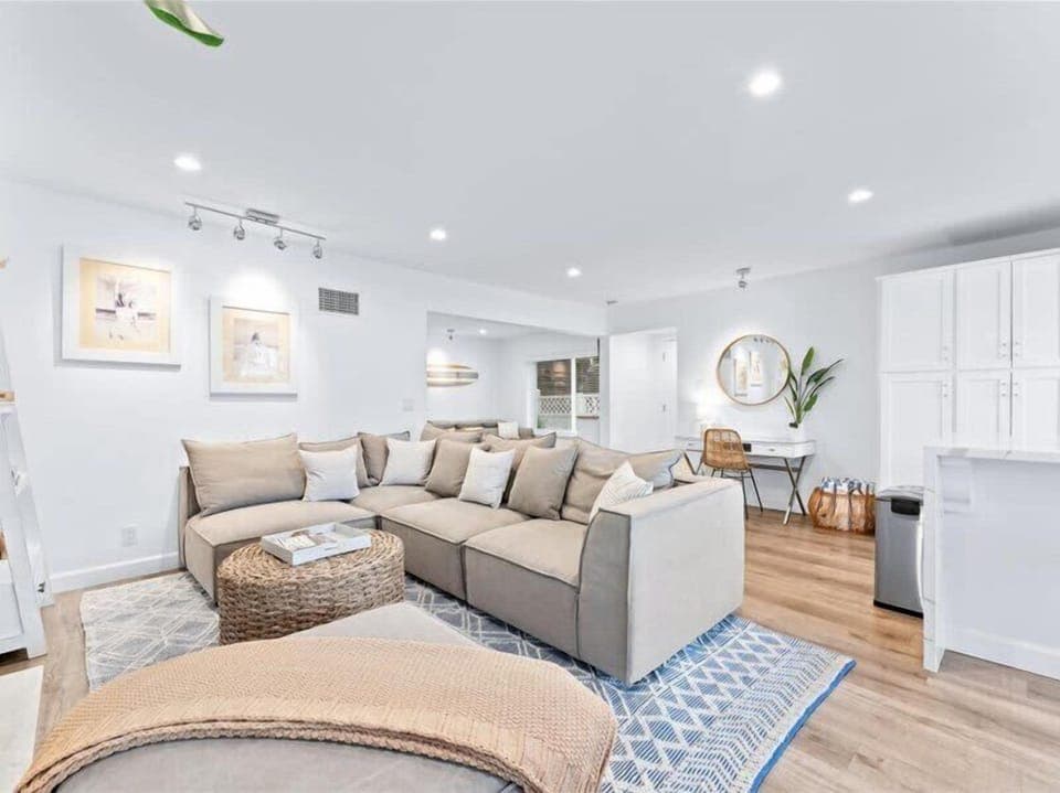 The living space offers plenty of natural light and a cozy fire place. It also provides outdoor access to your private deck that overlooks the bay.