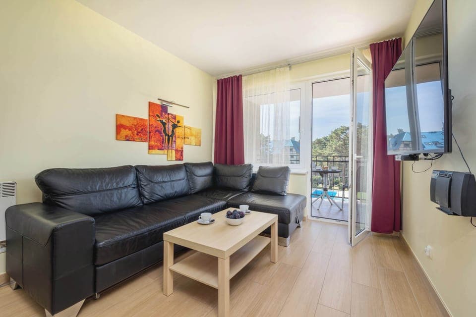 Living room with a comfortable sofa and TV. 