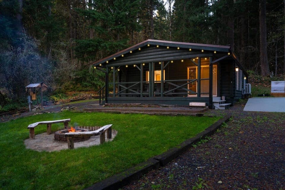 Unwind around the fire pit and enjoy the cozy ambiance of this tranquil cabin retreat.