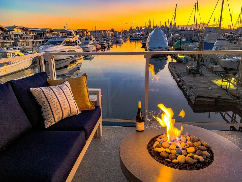 Welcome to Sailor's View! A bottle of wine at dusk around the fire table as the downtown Vancouver skyline lights up,  is a great way to end any day.