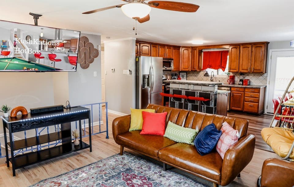 Make our living room the center of family moments, offering plush couches and a TV for delightful movie nights and bonding.