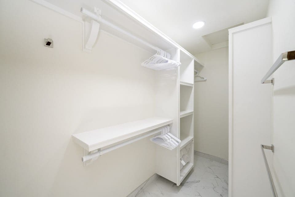 Guest suite includes a spacious walk-in closet—perfect for extended stays or unpack-and-relax living.