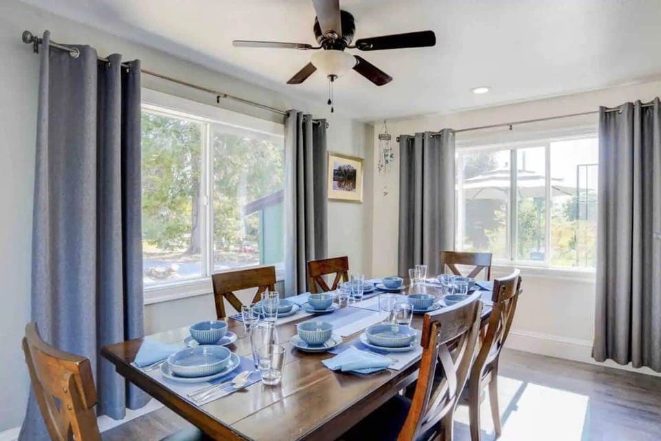 Enjoy family meals with stunning views of the patio and garden from the dining table.