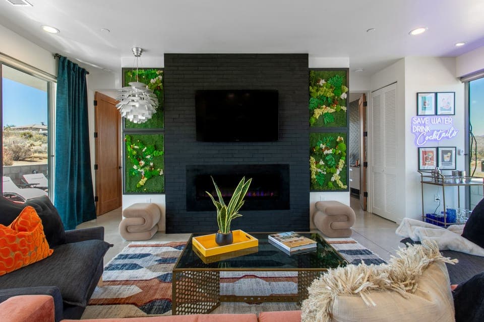 Living Room with Fireplace, TV and cocktail area.