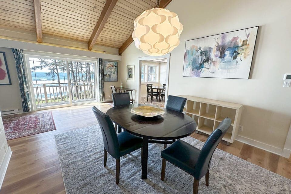 Separate dining area on the other side of the fireplace.