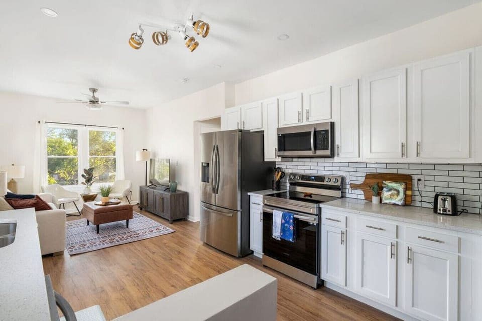 Fully Stocked Kitchen Open to Living Room