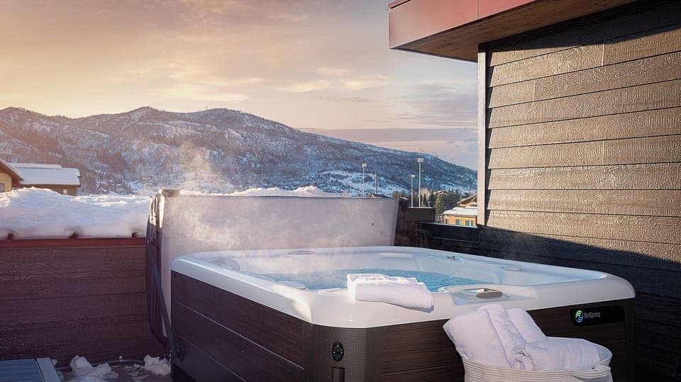 Winter hot tub with rooftop views of Emerald Mountain