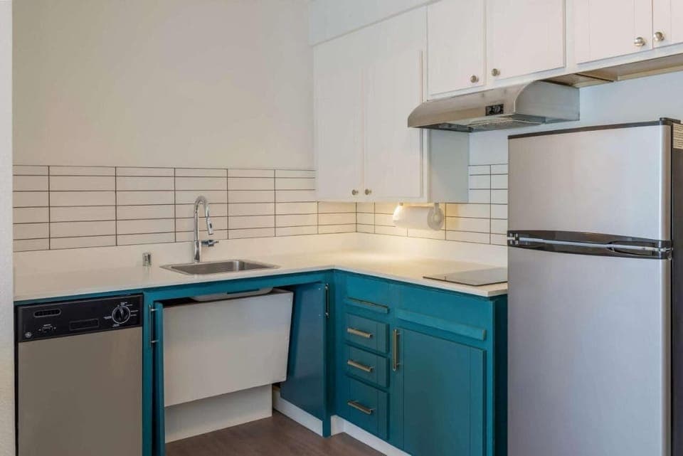 Cook simple favorites with full-size fridge and sleek counters.