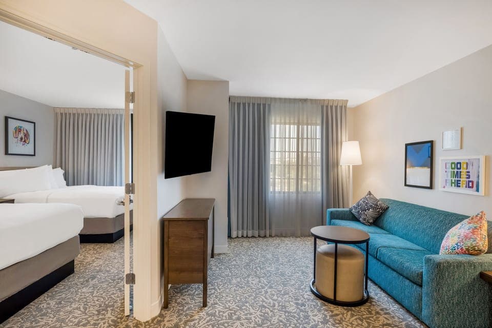 Relax in the airy lounge with easy flow to bedrooms.