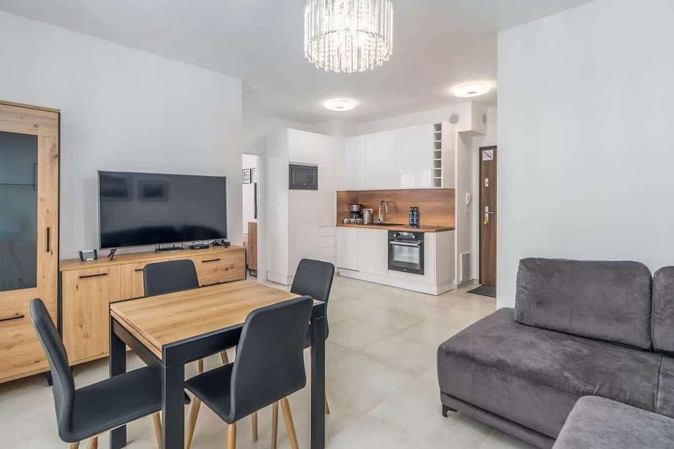Large table with chairs for eating communal meals. 