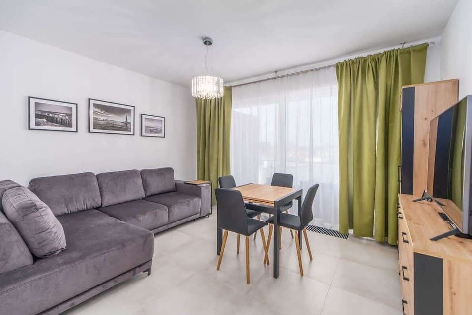 Living room with a comfortable sofa and TV. 